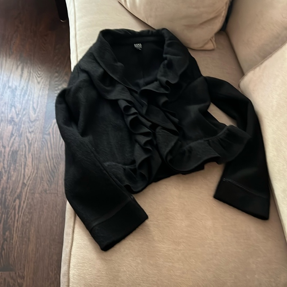 Stunning worn twice ruffled black jacket that goes with everything